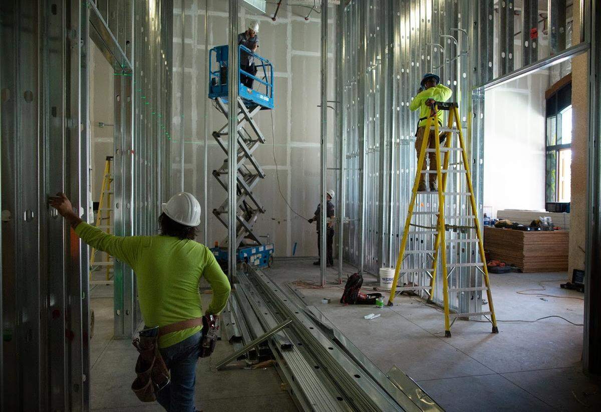A construction crew works to put up the soaring walls at Hodges Taylor’s new building at 1414 S. Tryon St. at the RailYard in South End.
