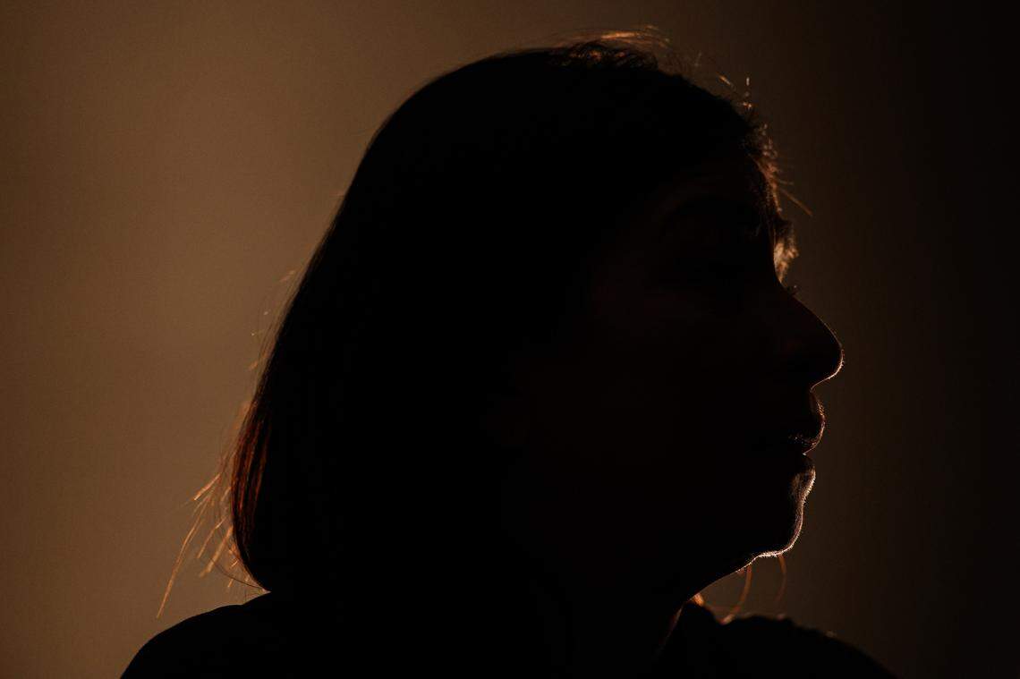“Amparo” is silhouetted to protect their anonymity while speaking about their undocumented status at Camino Center in Charlotte, NC on Tuesday, January 14, 2025.
