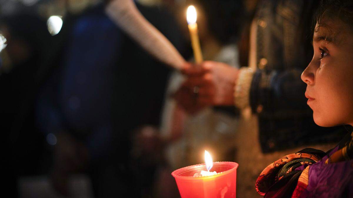 People hold candles as they attend a prayer vigil for then-terminally ill toddler Alfie Evans, in St. Peter's Square at the Vatican last month.