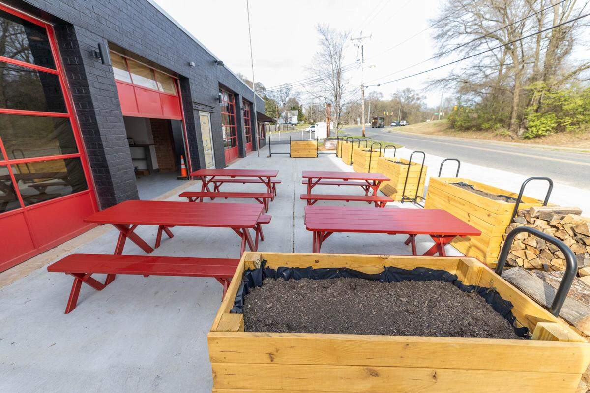 Firehawk offers outdoor seating and garage-door style rollup panels for bringing the outside indoors.