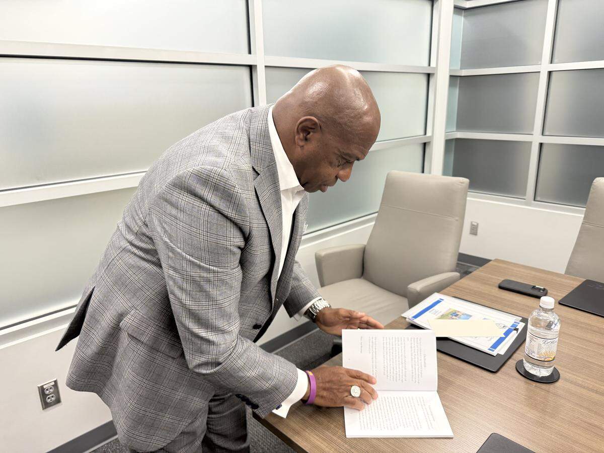 Sheriff Garry McFadden reads a book written by a former resident at Jail North, which was a juvenile detention center for years.