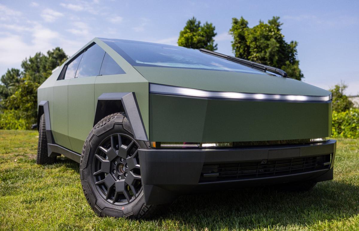 A Tesla Cybertruck with a green vinyl wrap by Brian Jenkins at i1Customs in Mooresville. The shop specializes in adding custom colors to the vehicles.