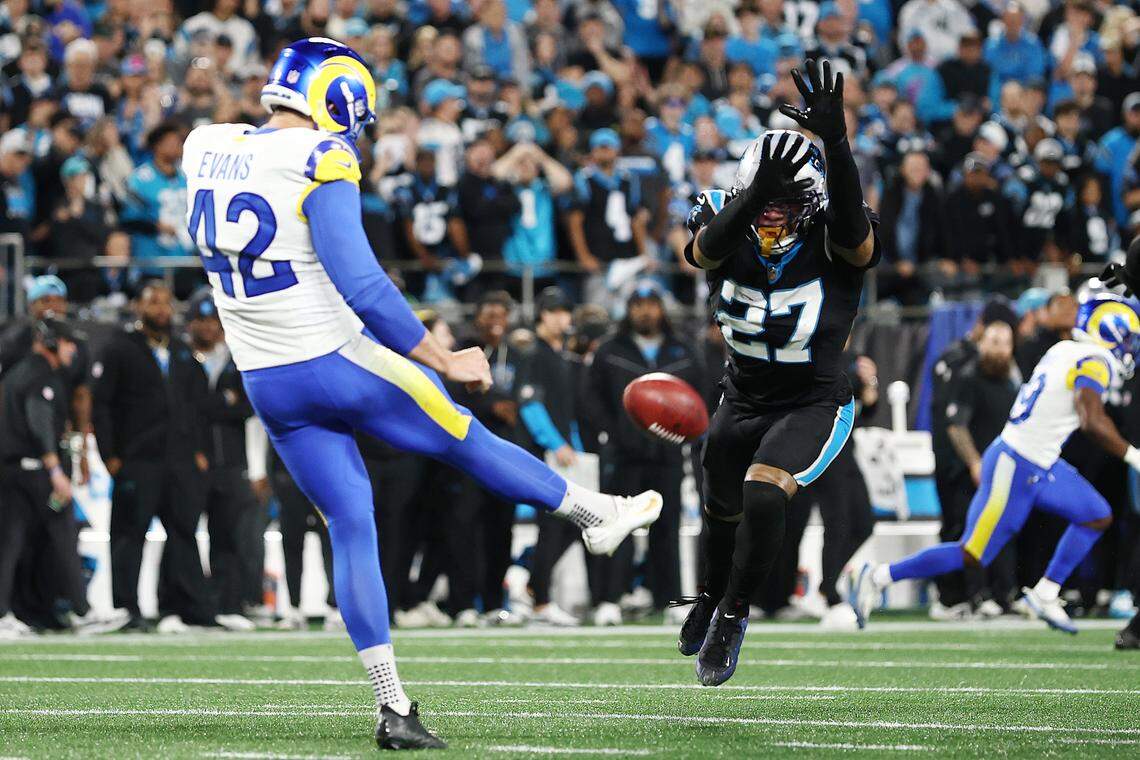 Carolina Panthers safety Isaiah Simmons blocks a punt by Los Angeles Rams punter Ethan Evans during their Jan. 10, 2026 wild-card game in Charlotte. 