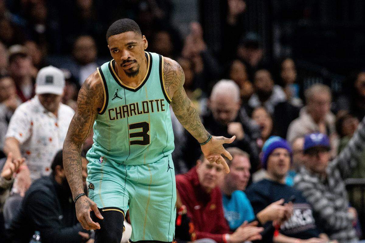 Charlotte Hornets guard DaQuan Jeffries (3) celebrates athree point basket against the Cleveland Cavaliers during the fourth quarter at Spectrum Center.