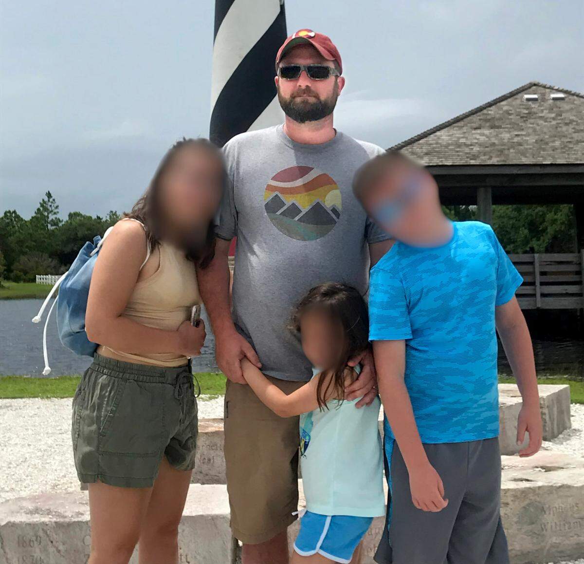 Chris Craven, shown with his family in an undated photo, was shot and killed by police outside his Mooresville home in August 2020. Police say he pointed a gun at them, an allegation his wife, Amy, disputes. She filed a federal lawsuit against the officers involved and the town.