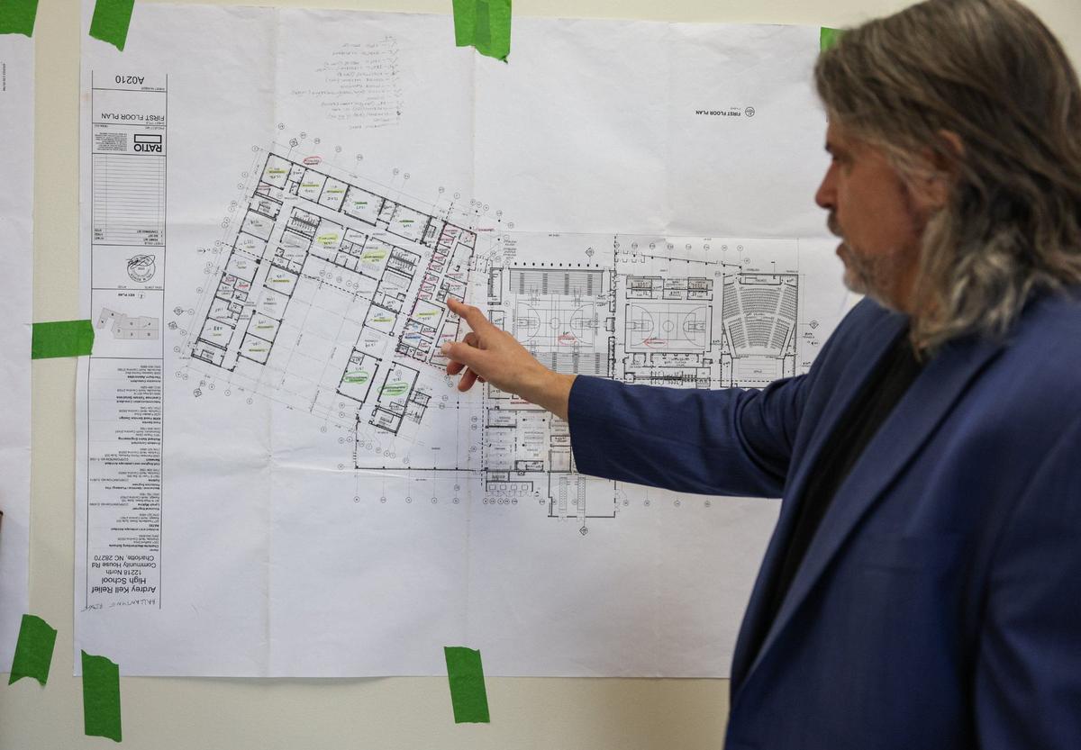 Dennis LaCaria, executive director of facilities management for CMS, explains the layout of Ballantyne Ridge.