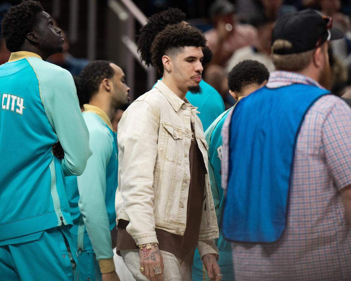 Charlotte Hornets guard LaMelo Ball sits out against the Orlando Magic during the second quarter at KIA Center.