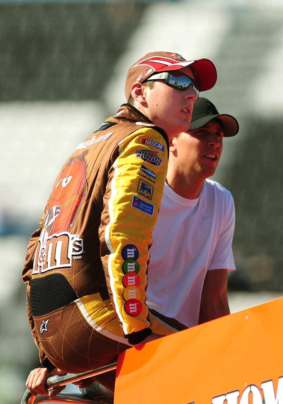 NASCAR drivers Kyle Busch and Denny Hamlin watch practice from atop driver Joey Logano's Home Depot Toyota transporter at Daytona International Speedway in Daytona Beach, Florida, Friday, February 13, 2009. (Jeff Siner/Charlotte Observer/MCT)  