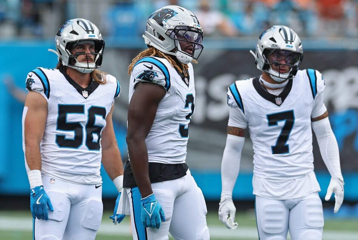 Carolina Panthers linebackers Christian Rozeboom, left and Princely Umanmielen, center and safety Tre'von Moehrig, right, wait to line up against the Miami Dolphins offense during action on Sunday, October 5, 2025 at Bank of America Stadium in Charlotte, NC. The Panthers defeated the Dolphins 27-24.