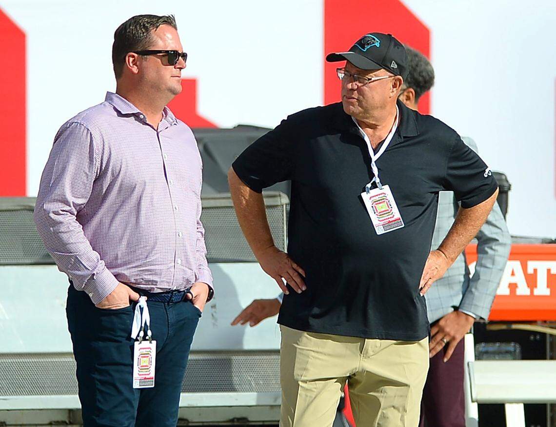 Carolina Panthers team owner David Tepper, right, speaks with general manager Scott Fitterer at Raymond James Stadium in Tampa, Fla., on Sunday, January 9, 2022. The Panthers later lost their season finale, 41-17, to the Tampa Bay Buccaneers to finish the season 5-12.