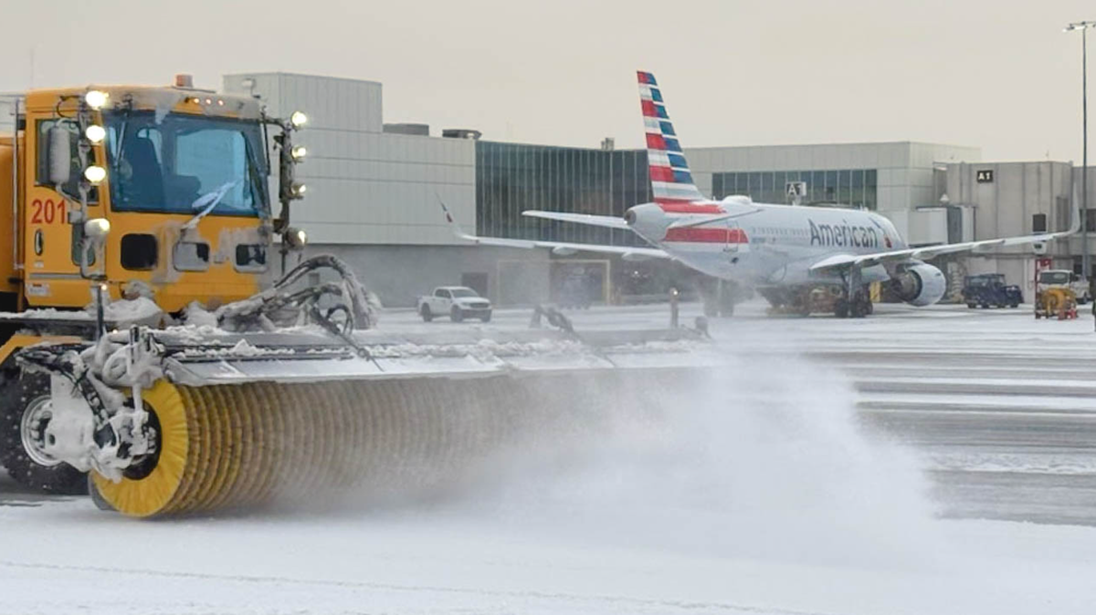 At Charlotte Douglas International Airport, work crews remove accumulation from Winter Storm Fern. American Airlines, the largest provider of flights, is preparing for another weekend storm for the end of January and the start of February. 