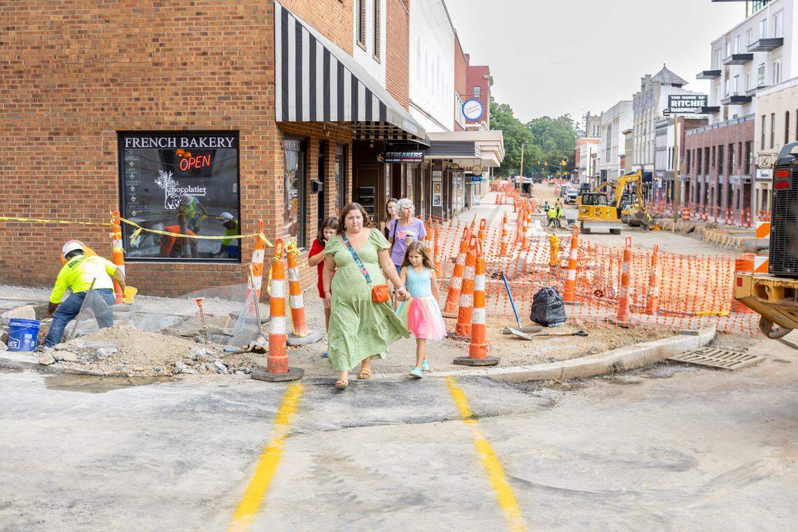 Shoppers navigate the intersection of Cabarrus Avenue and Union Street in downtown Concord.