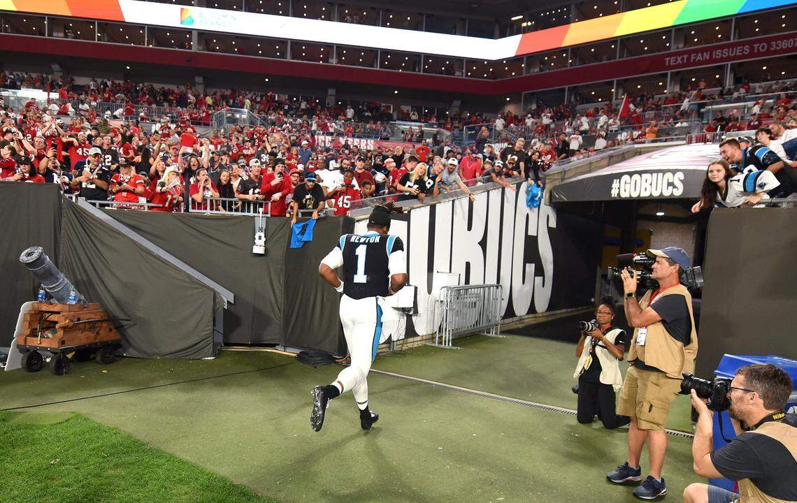 Carolina Panthers quarterback Cam Newton jobs off the field at Raymond James Stadium in Tampa, Fl. on Sunday, January 9, 2022. The Panthers lost to the Tampa Bay Buccaneers 41-17.