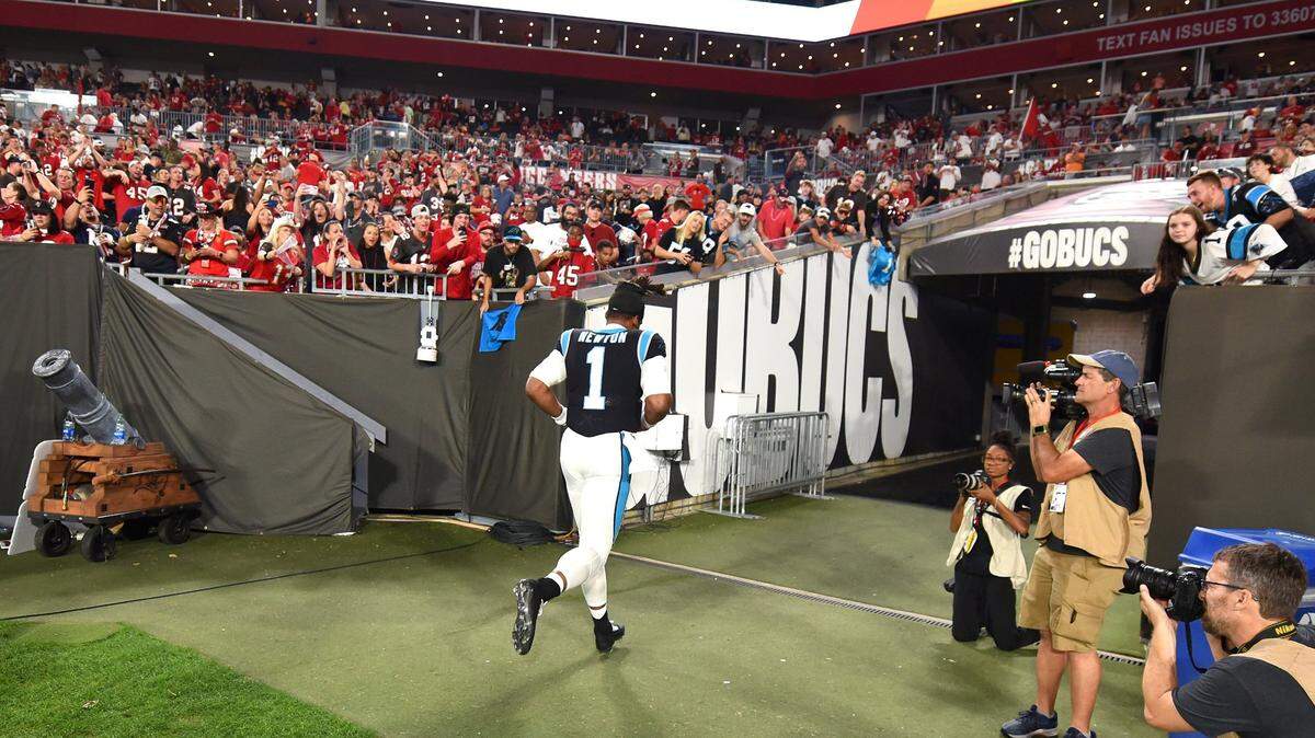 Carolina Panthers quarterback Cam Newton jobs off the field at Raymond James Stadium in Tampa, Fl. on Sunday, January 9, 2022. The Panthers lost to the Tampa Bay Buccaneers 41-17.