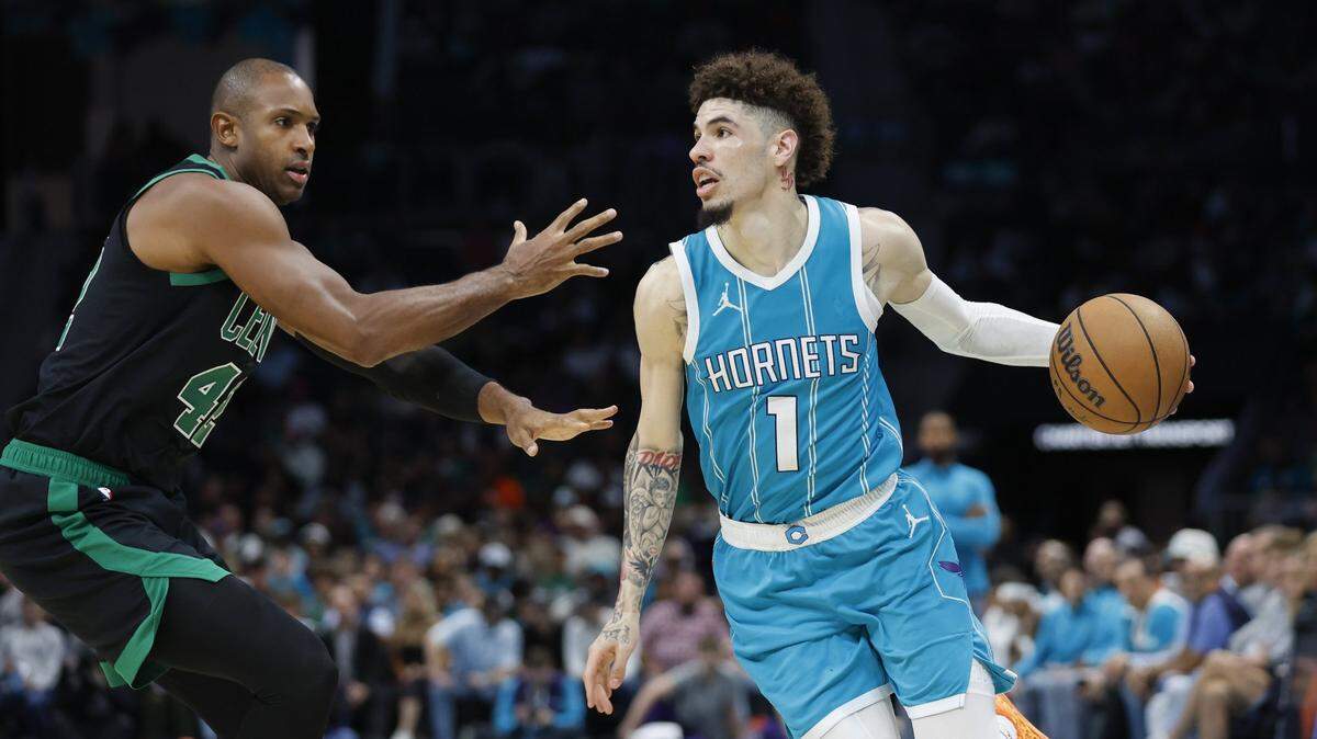 Charlotte Hornets guard LaMelo Ball (1) drives the baseline against Boston Celtics center Al Horford (42) during the second half at Spectrum Center.