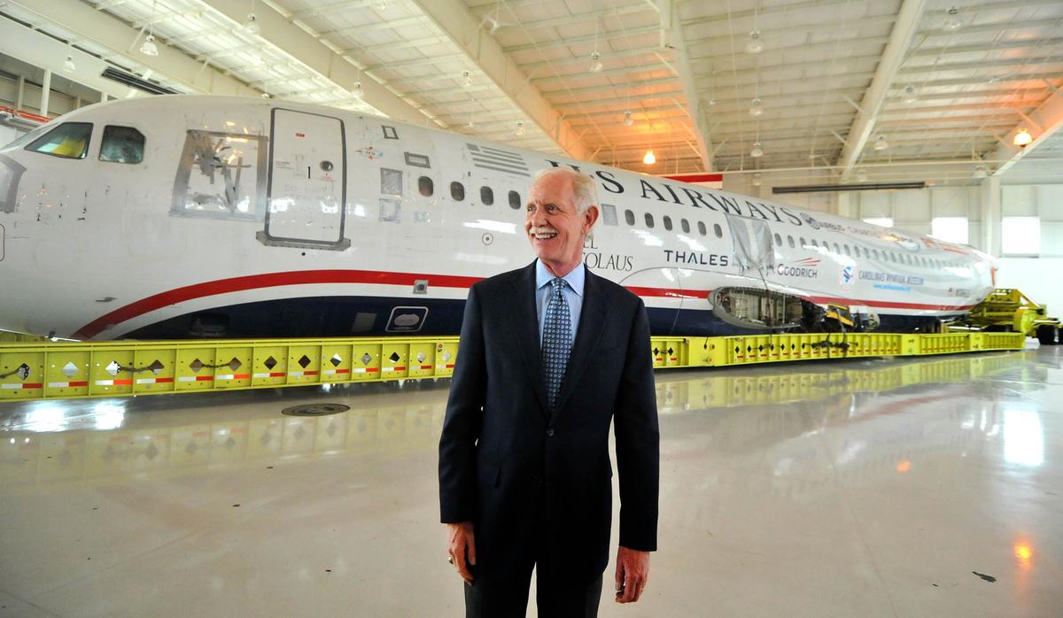 Capt. Chesley “Sully” Sullenberger stands in front of the US Airways Flight 1549 fuselage at the Carolinas Aviation Museum in June 2011. He and other crew members met that year with passengers to recall their memorable water landing and to celebrate the plane’s arrival at the museum. They are gathering again Tuesday.