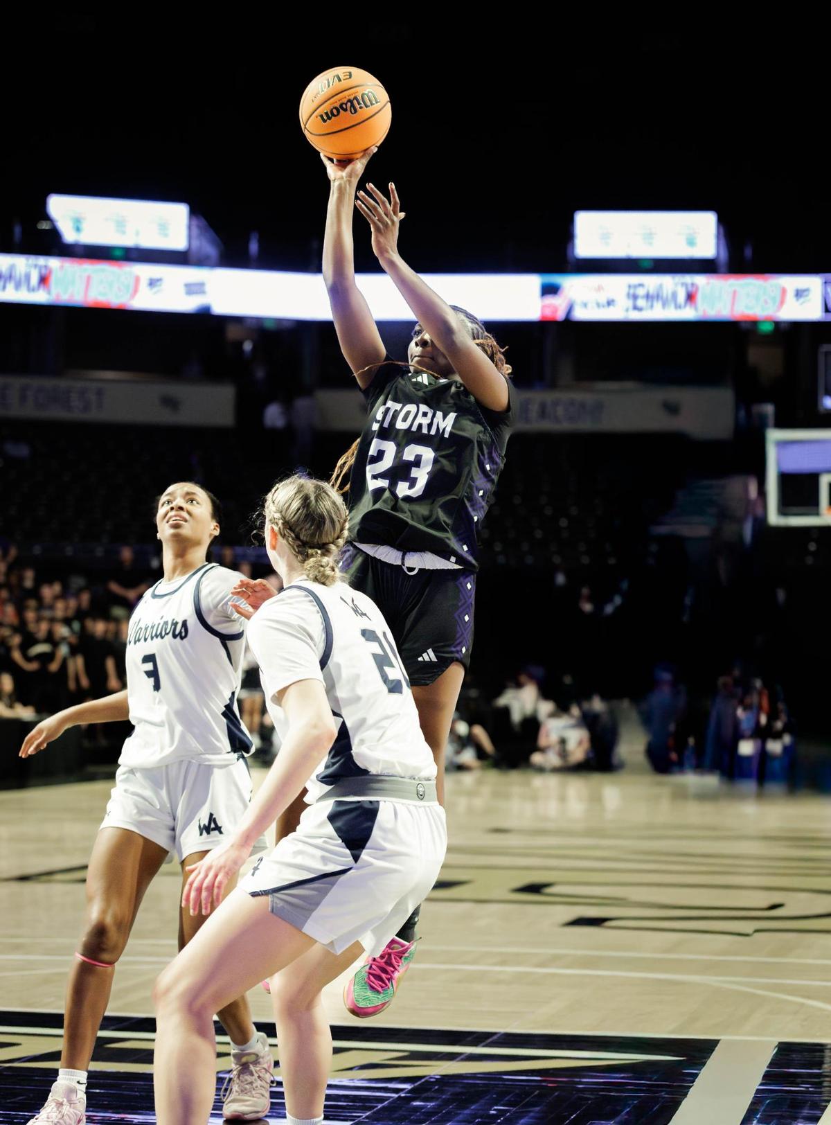 Stuart Cramer’s Oshauna Holland (23) pulls up in the lane for the 2-point basket. Stuart Cramer would play Western Alamance in the 3A NCHSAA State Championship Friday March 14, 2025.