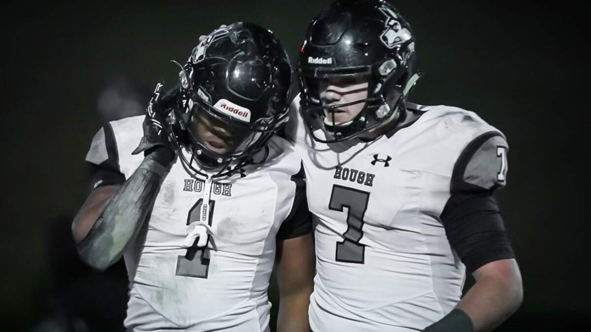 Hough QB Tad Hudson (right) congratulates JT Smith after a fourth quarter touchdown run