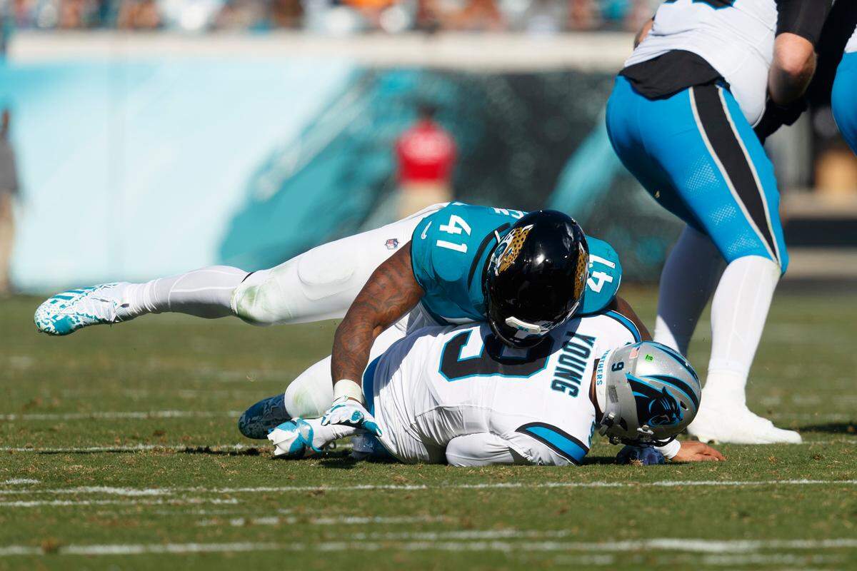 Jacksonville Jaguars outside linebacker Josh Allen (41) sacks Carolina Panthers quarterback Bryce Young (9) during the second quarter at EverBank Stadium.