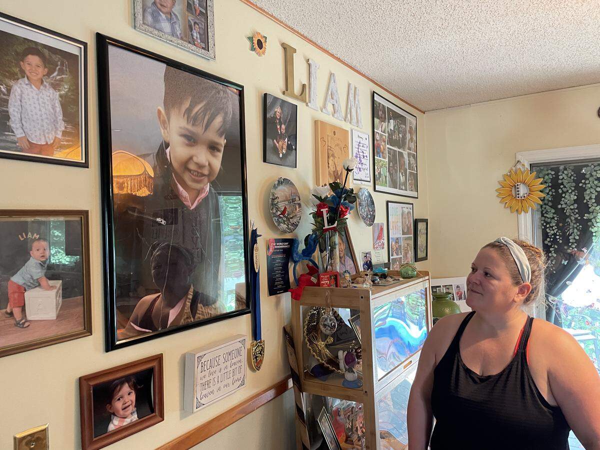 Brandi Birrittier looks at a photo of her son, Liam Lagunas, hanging at her mother’s house on Aug. 15. Liam died in a street racing wreck in 2021.