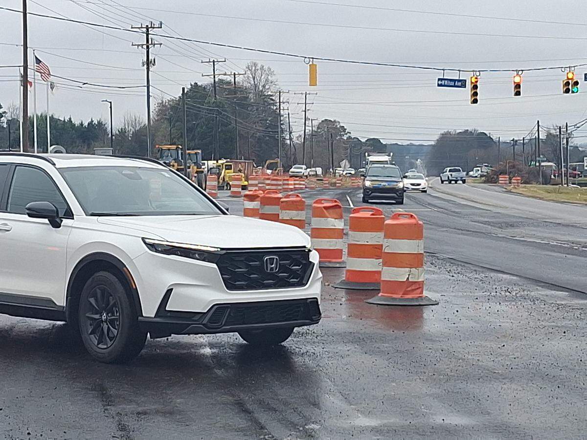 A driver turns right from West Wilson Avenue onto U.S. 21 North in a new, wider turn lane that opened in Mooresville on Monday, Dec. 8, 2025.