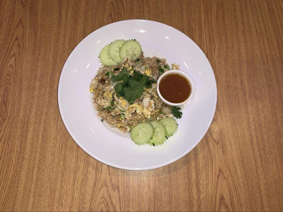 The crab fried rice is prepared with simple ingredients, including lump crab meat.