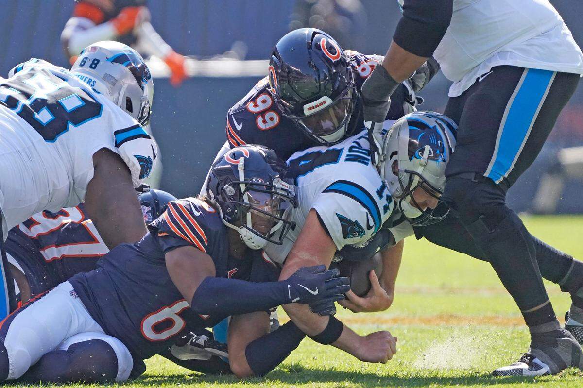 Chicago Bears cornerback Kyler Gordon (6) and defensive tackle Gervon Dexter Sr. (99) sack Carolina Panthers quarterback Andy Dalton (14) during Sunday’s first half at Soldier Field. David Banks-Imagn Images