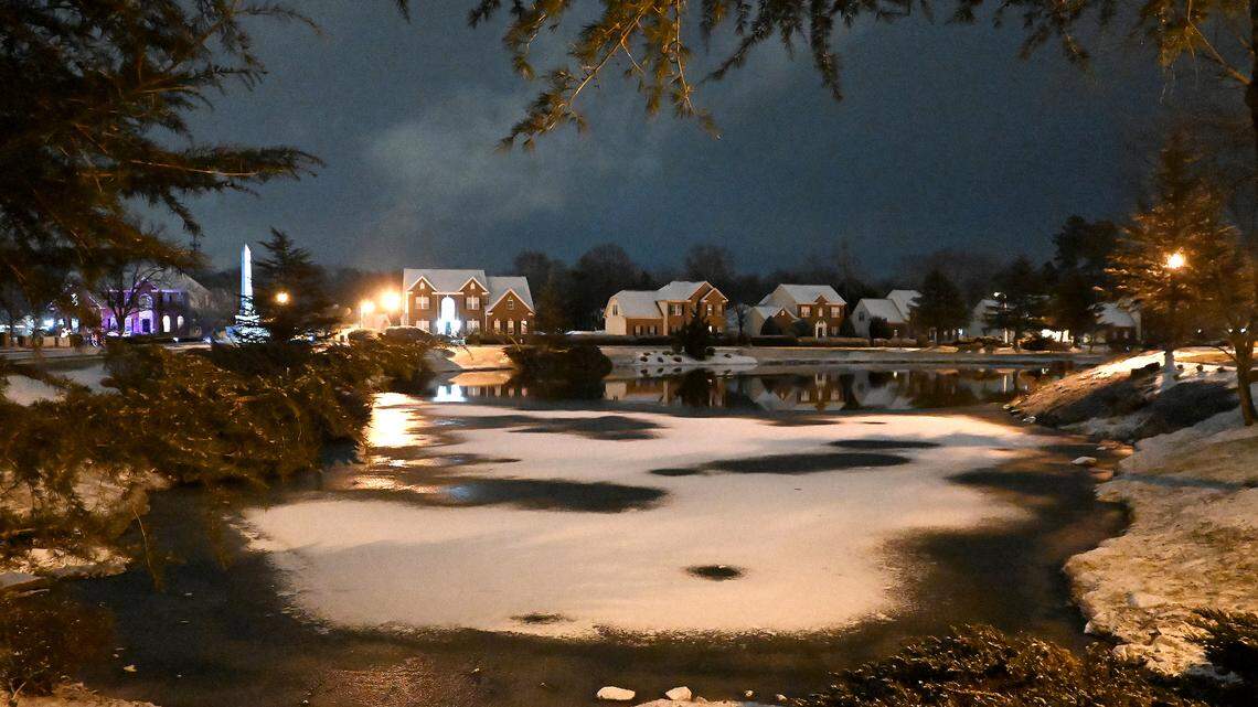 A dust of snow covers the roof tops of homes and a portion of a pond in the Village of Lake Park in Union County on Tuesday, January 21, 2025.