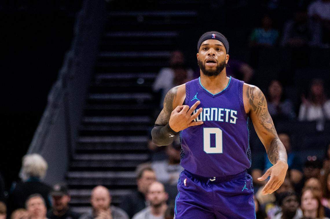 Charlotte Hornets forward Miles Bridges (0) celebrates a three point basket against the Washington Wizards during the first quarter at Spectrum Center.