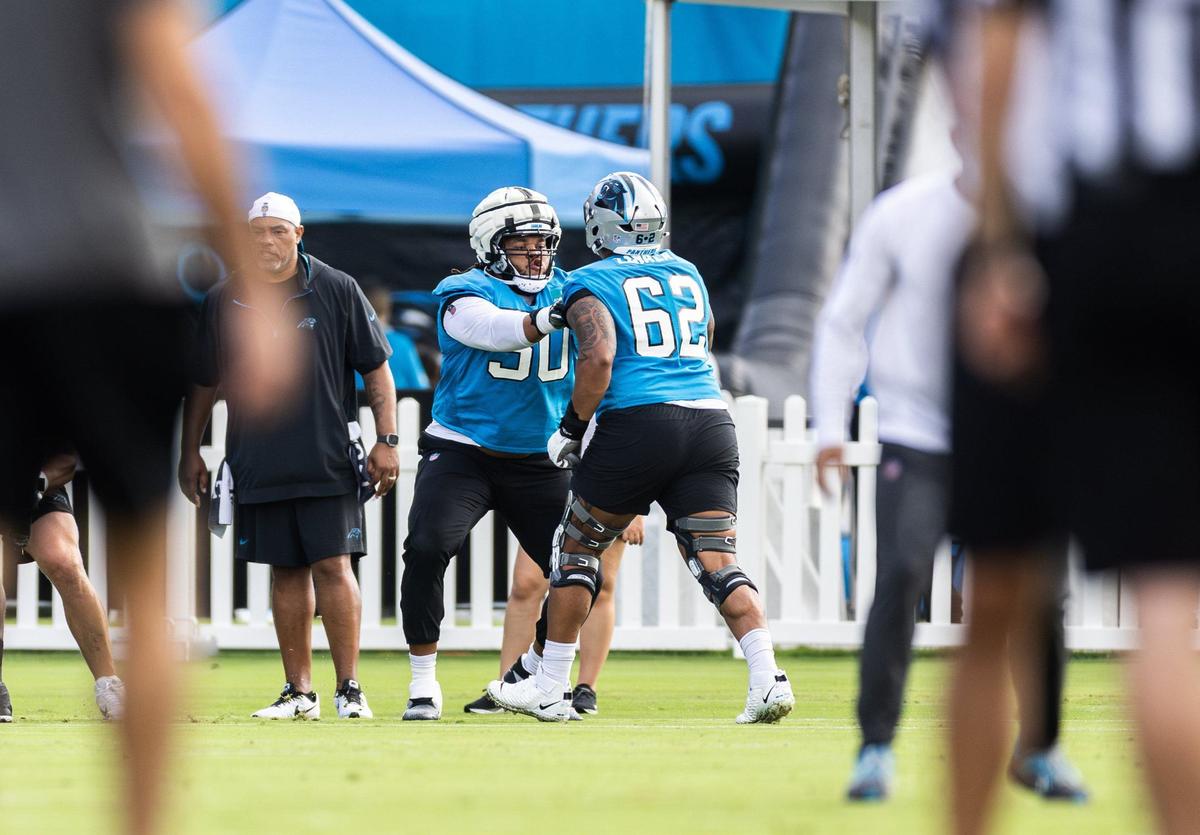Carolina Panthers Robert Hunt, left and Chandler Zavala run a drill during the Carolina Panthers Training Camp in Charlotte, N.C., on Monday, August 5, 2024.