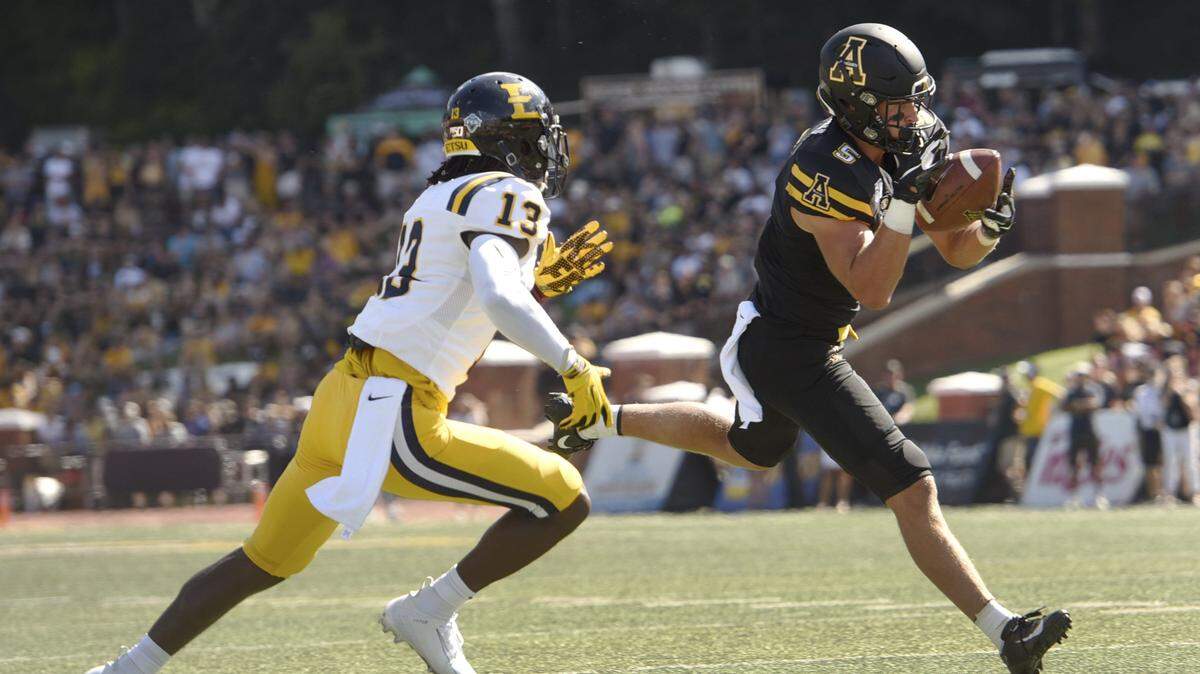 Appalachian State’s Thomas Hennigan (5) catches a pass near the goal line in front of East Tennessee State’s Jeremy Lewis (13) in an NCAA football game, Saturday, Aug. 31, 2019, in Boone, N.C. (Walt Unks/Winston-Salem Journal via AP)