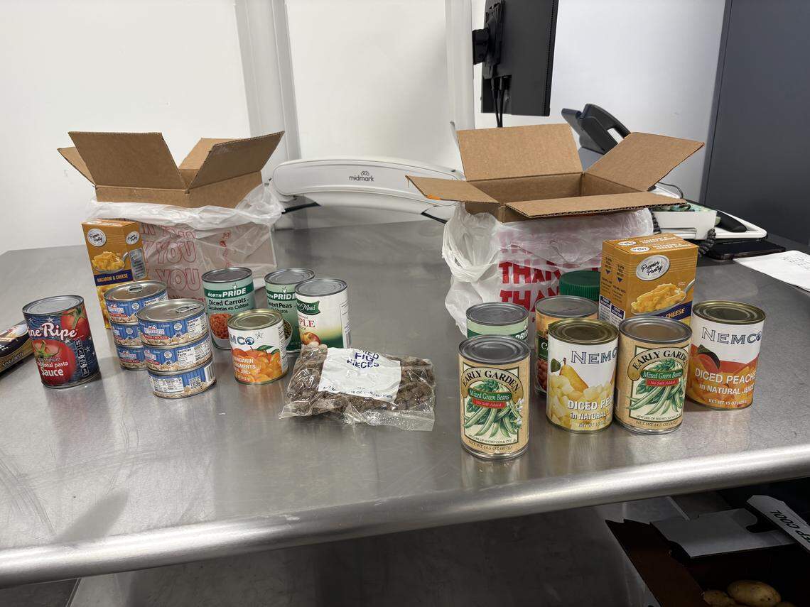 Food boxes for people in need during the pause in SNAP benefits due to the federal government shutdown contain protein, nonperishables and other items at the food pantry inside the Ella B. Scarborough Community Resource Center.