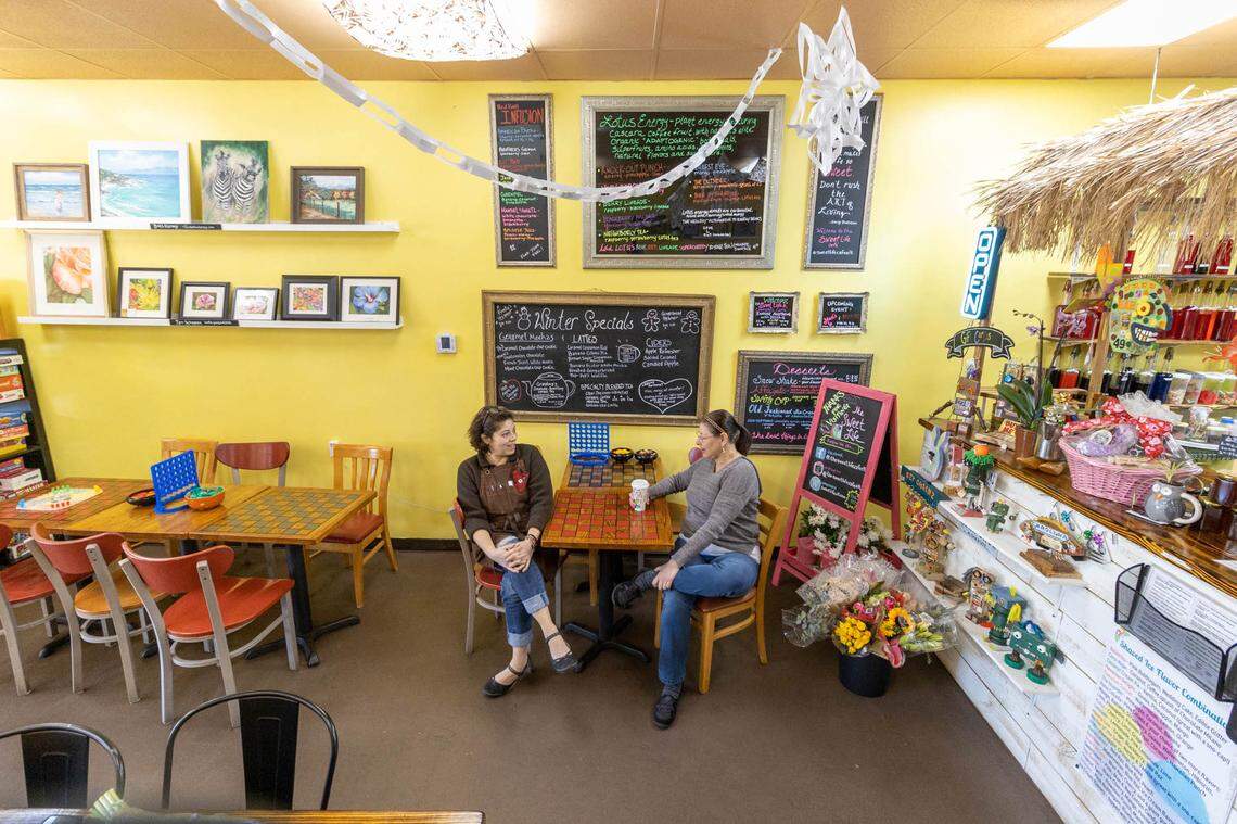 Sweet Life Cafe owner Julie Shrader and customer Blanca Sizemore sit down together to chat in March 2022.
