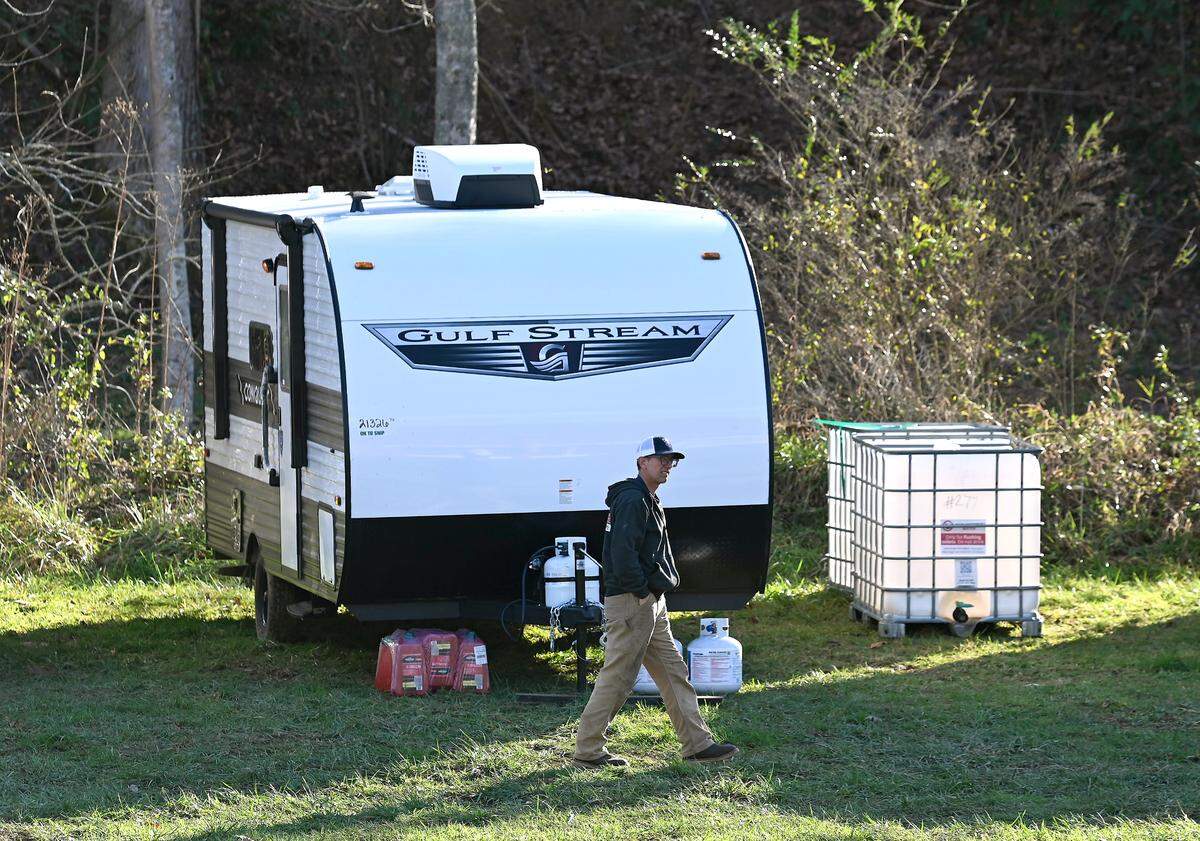Chris Walton examines the campers left at West Yancey V.F.D. Station 14 in Burnsville on Nov. 25 by Operation Helo.