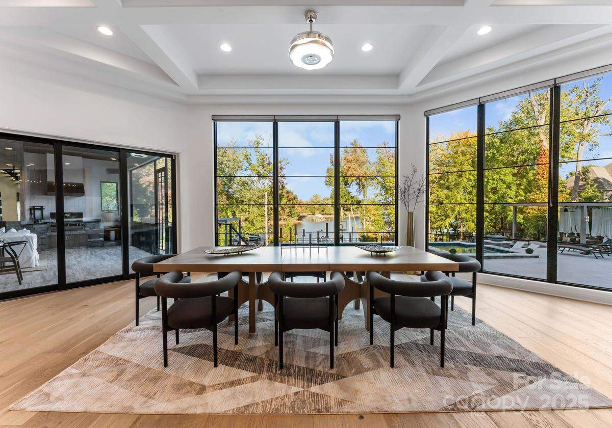 Light enters the home through large glass windows.