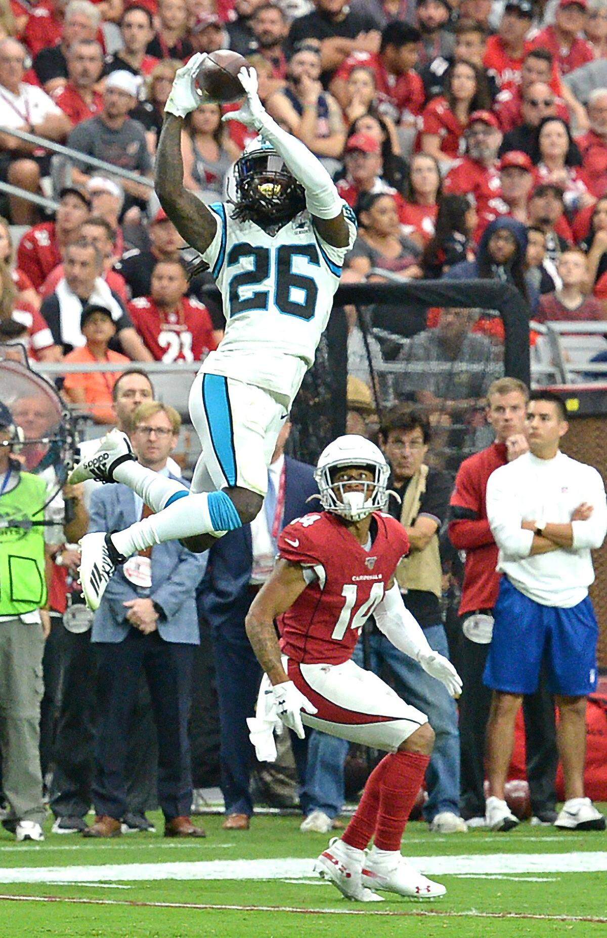 Carolina Panthers cornerback Donte Jackson, left, intercepts a pass meant for Arizona Cardinals wide receiver Damiere Byrd in 2019.
