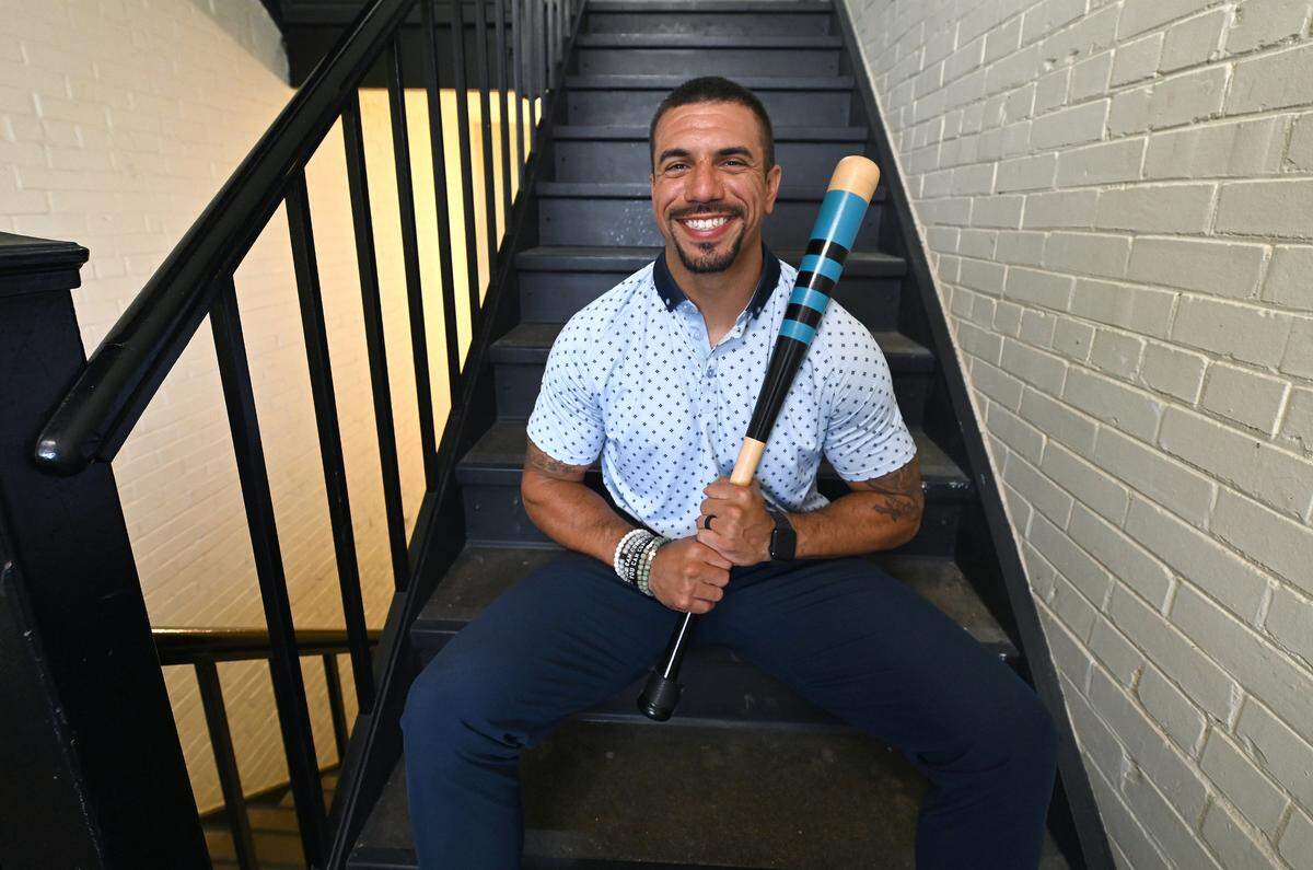 Former Carolina Panthers safety Kurt Coleman in April. He is holding a bat that center Ryan Kalil had made to commemorate the team’s bat controversy during the 2015 season.