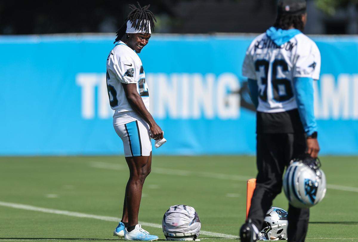 Panthers cornerback Chau Smith-Wade, left, jokes with teammate Demani Richarson during training camp in Charlotte, NC on Tuesday, July 29, 2025.