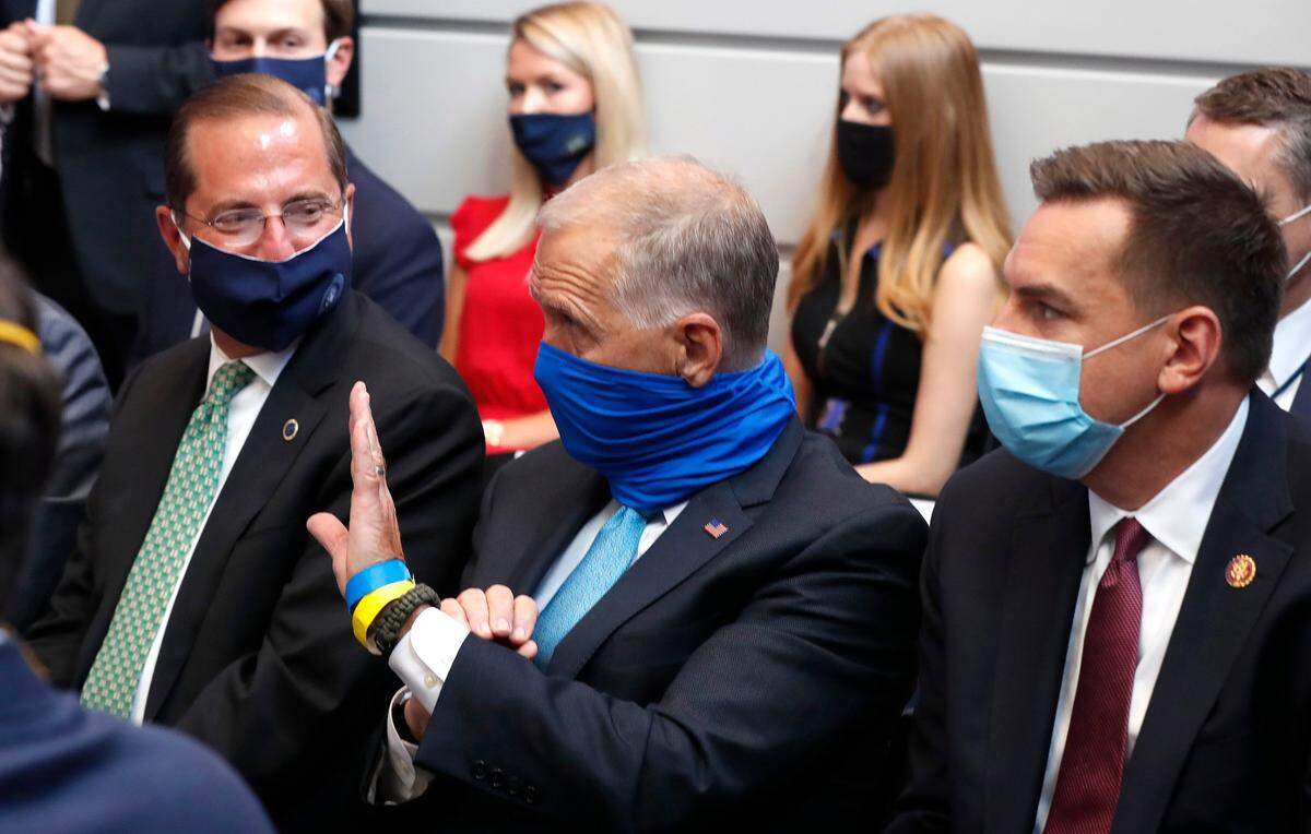 U.S. Rep. Richard Hudson, alongside U.S. Sen. Thom Tillis and Secretary of Health and Human Services Alex Azar, at a briefing in Morrisville, N.C. in July. Both Hudson and Tillis are in the midst of competitive re-election races.