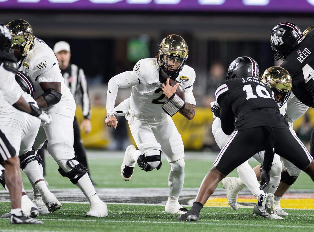 Wake Forest quarterback Robby Ashford (2) runs for a first down. Wake Forest played Mississippi State in the Duke's Mayo Bowl at Bank of America Stadium on Friday, Jan. 2, 2026.