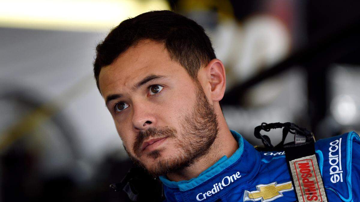 FILE - In this July 27, 2019, file photo, Kyle Larson climbs into his car for a practice session for the NASCAR Cup Series auto race in Long Pond, Pa. Kyle Larson was fired Tuesday, April 14, 2020, by Chip Ganassi Racing, a day after nearly every one of his sponsors dropped the star driver for using a racial slur during a live stream of a virtual race. Larson, in his seventh Cup season with Ganassi and considered the top free agent in NASCAR mere weeks ago, is now stunningly out of a job in what could ultimately be an eight-figure blunder by the star. (AP Photo/Derik Hamilton, File)