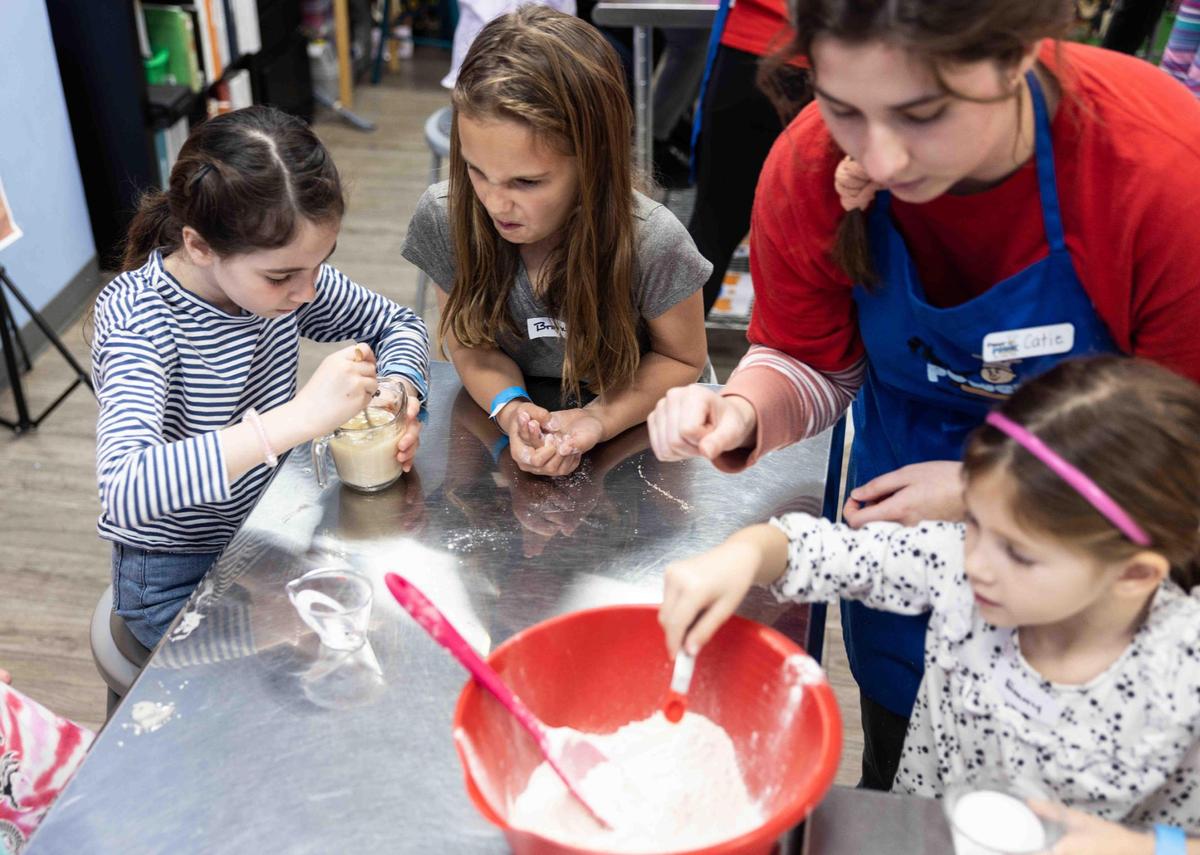 Instructors work alongside campers to go through each recipe step by step, while also teaching them about every ingredient and kitchen tool used in the process.