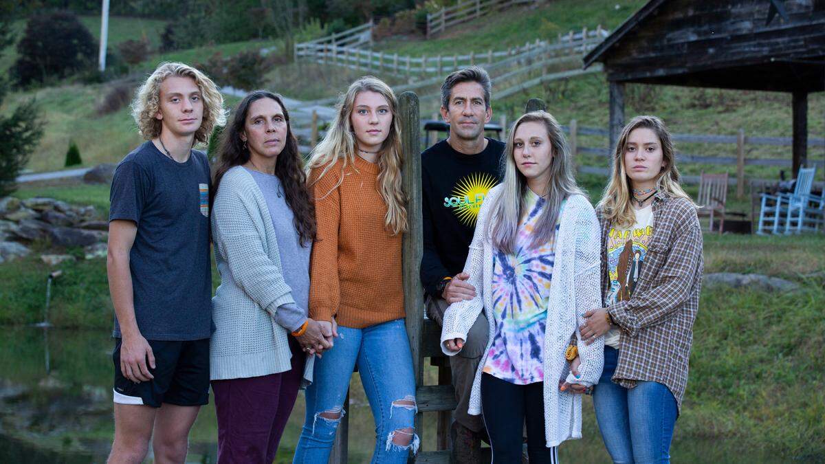 Riley Howell’s family — brother Teddy, mom Natalie, sister Juliet, father Thomas and sister Iris — with Riley’s girlfriend Lauren Westmoreland (far right), photographed six months after the April 30, 2019 shooting.