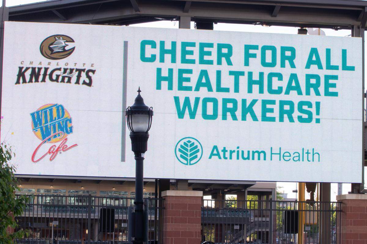 Signs at BB&T Ballpark encouraged people uptown to cheer for health care workers, who are putting themselves at risk during COVID-19.