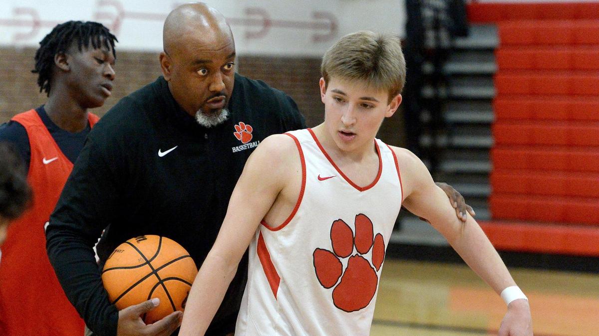 South Meck Head Coach Chris McDonald (left) directs #5 Will Rothacker, a senior as McDonald led the team through practice Wednesday, Jan. 3, 2024.The South Meck Sabres are 13-0 this season They face off against, 4A power, Richmond, on Saturday.