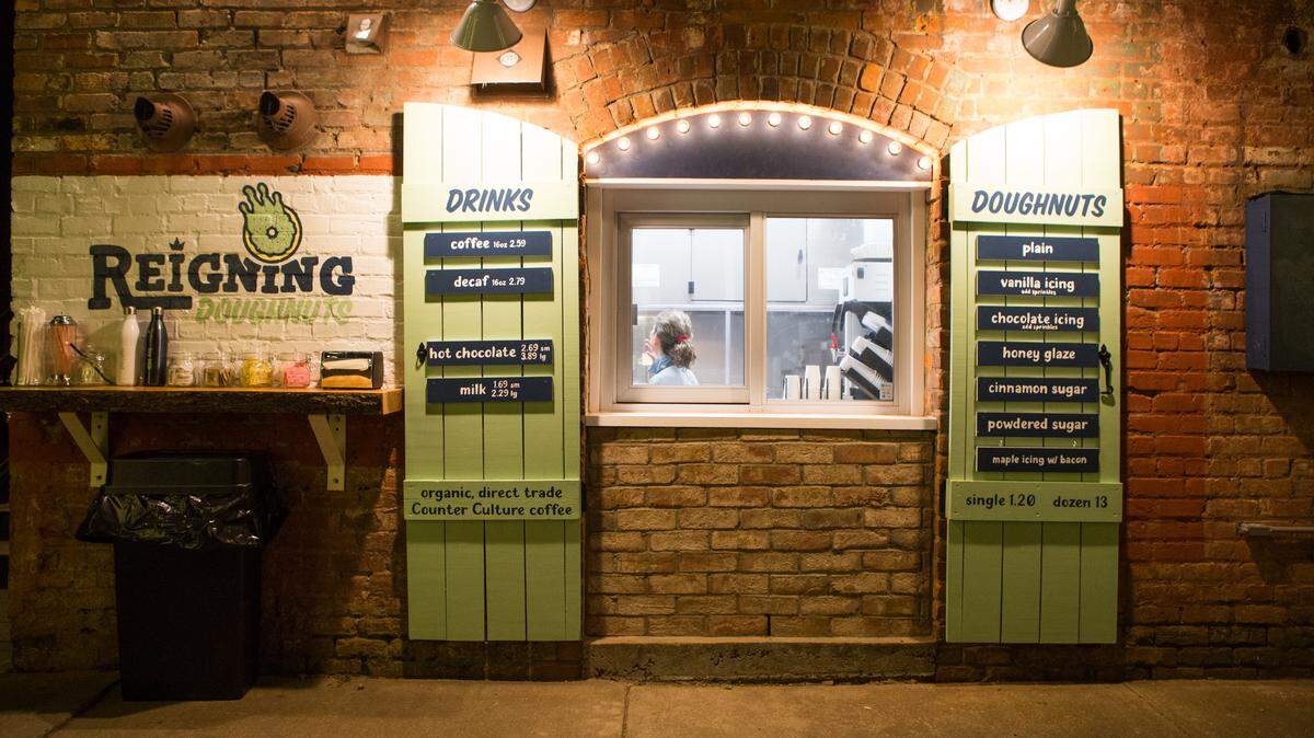 Reigning Doughnuts operates out of a walk-up window on East 35th Street that once served as a supply closet for Growler’s Pourhouse.