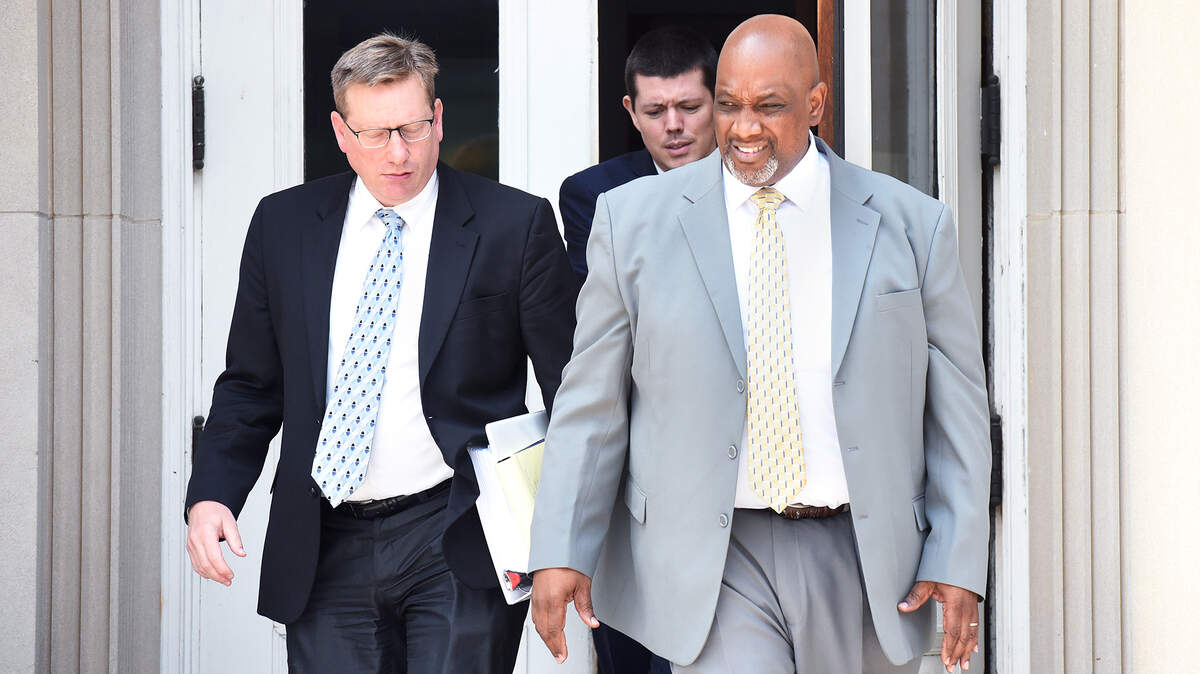 Lawrence Parsons, right, the former prison administrator at Lanesboro Correctional Institution, left the federal courthouse in Charlotte with his lawyers on a lunch break on Tuesday, July 17, 2018. On Thursday, a federal jury ruled that Parsons was not deliberately indifferent to the safety of inmates.