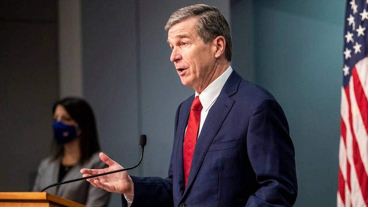 Gov. Roy Cooper speaks during a Dec. 1 briefing in Raleigh on North Carolina’s coronavirus pandemic response. On Dec. 8, amid rising COVID-19 cases and deaths, Cooper announced a curfew for the state.