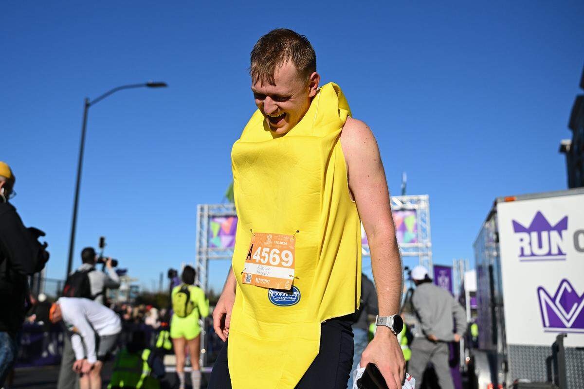A participant smiles after taking part in the 20th annual Novant Health Charlotte Marathon on Saturday, Nov. 16, 2024, in Charlotte