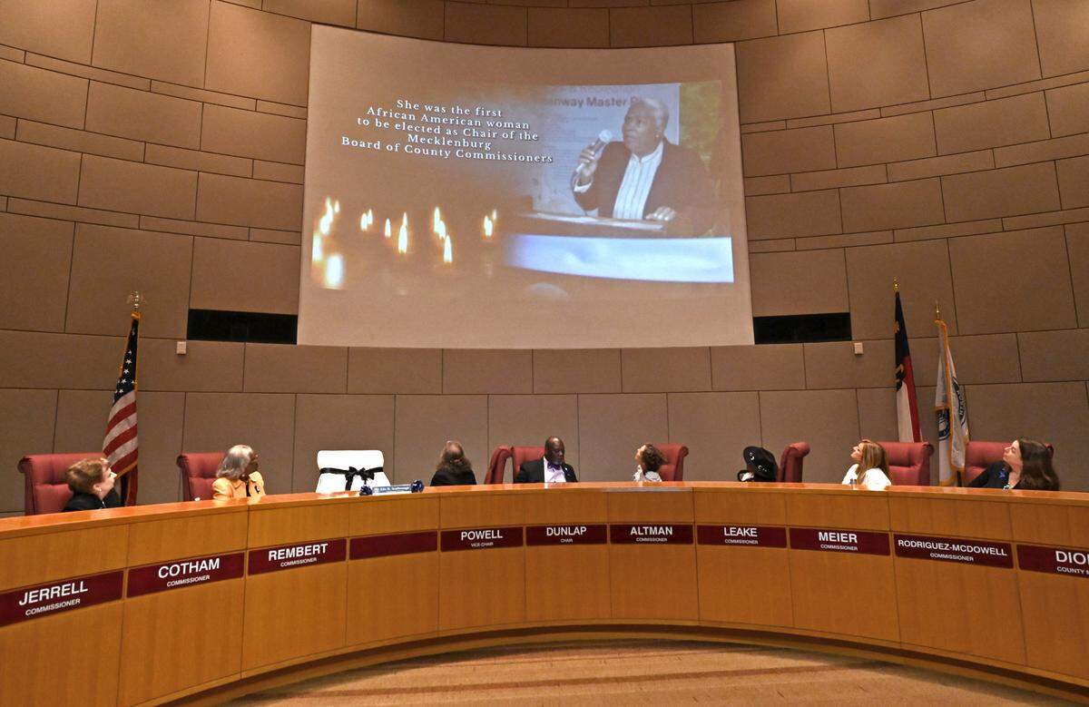 Members of the Mecklenburg County Board of Commissioners watch a tribute video to Commissioner Ella B. Scarborough who passed away on on Tuesday, May 24, 2022.
